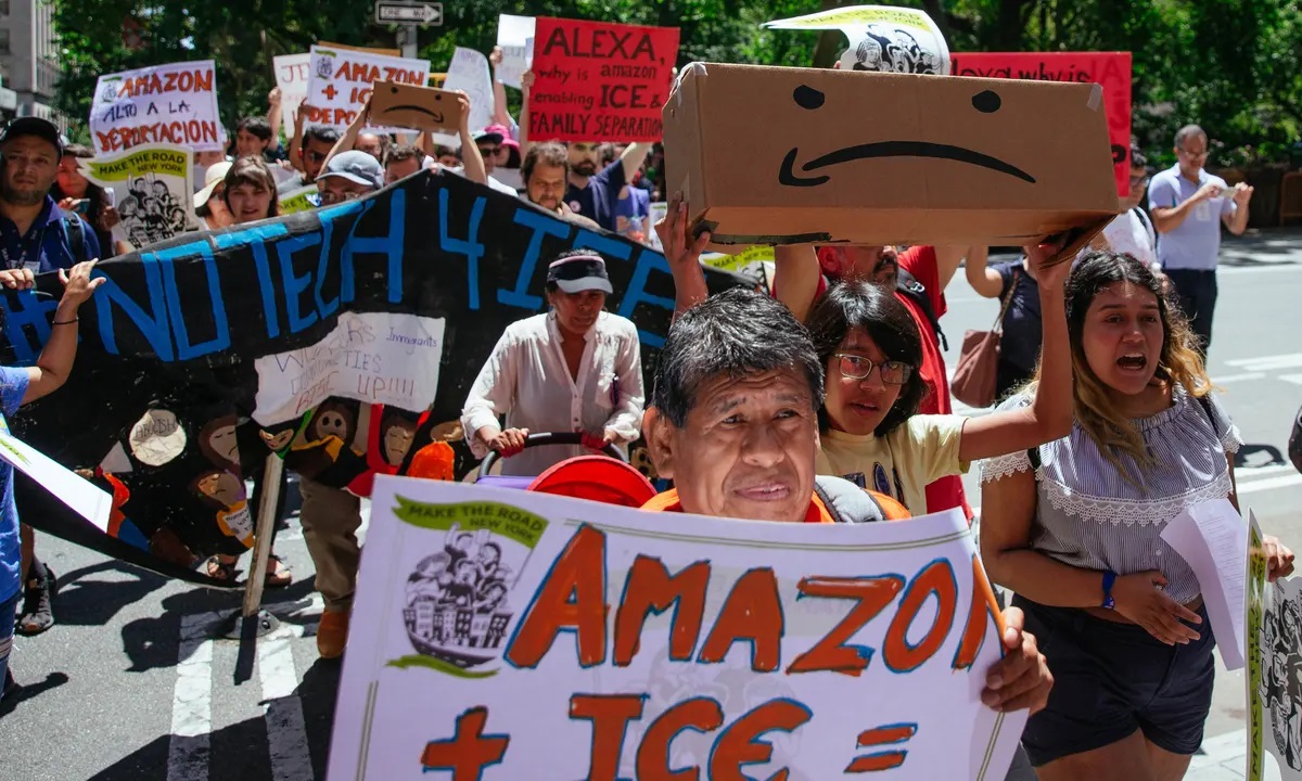 A crowd marching at a protest against Amazon's support of ICE