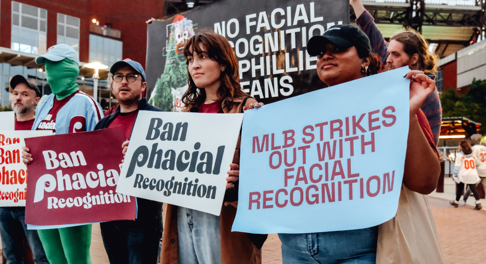 Fans protesting MLB's use of facial recognition outside a Phillies game.