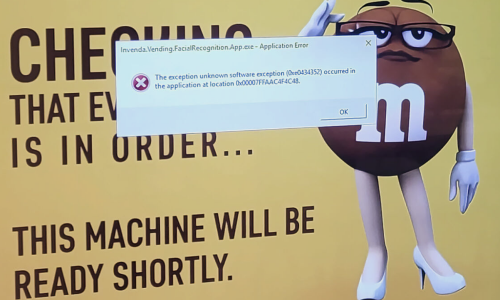 Photo of M&Ms vending machine with facial recognition error code